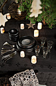 Crockery and candle lanterns on Christmas table