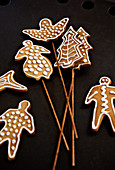 Decorated gingerbread shapes on wooden skewers