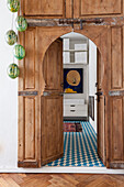 Melon lamps hanging from a Moroccan wooden door