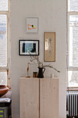 Simple wooden cupboard and vintage art pieces in an old building