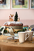 Christmas cake with animal figures and fir trees