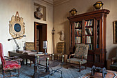 Oak furniture, antique chairs, desk, busts and globes in study