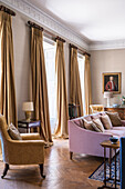 Gold and pink furnished drawing room in 18th century mansion