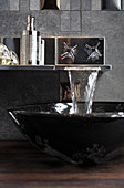 Sink with waterfall tap in designer bathroom