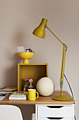 Desk with articulated lamp