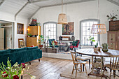 Open living room with vintage furnishings in converted chapel