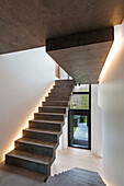 Staircase with illuminated concrete steps