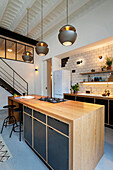 Custom-made open kitchen with kitchen island in a loft