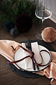 Place setting decorated with velvet ribbon