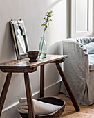 Rustic wooden stool and old wooden bowl as a decoration and side table