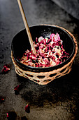 Dried rose petals in a bowl