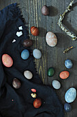 Easter eggs dyed with natural dyes, on wooden background