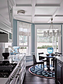 Open kitchen with white coffered ceiling and light blue walls