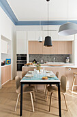 Bright kitchen with dining area in renovated old flat