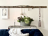 View over sofa of vintage zinc tub with flowers