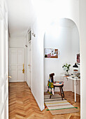 Small office space with a round arch in an old apartment