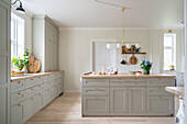 Classic kitchen with grey coffered fronts and floorboards