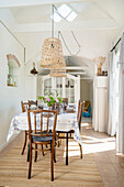 Set table in the rustic dining room with open ceiling