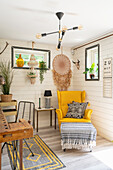 Yellow armchair and Boho decor in the study