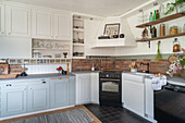 Bright country kitchen with white and light grey cupboards
