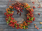Autumn wreath made from pyracantha, rose hips, dogwood and spurge
