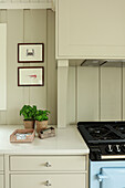 Gas cooker in the beige kitchen with wall panelling