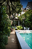 Swimming pool on lushly planted terrace