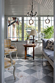 View into the winter garden with grey and white chequered wooden floor