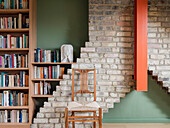 Library and study in the converted and extended attic, detail of the surviving chimney stack