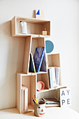 A homemade shelf made from wooden boxes