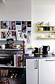 Kitchen corner with wall collage and shelves