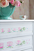 Hand painted floral motifs on vintage chest of drawers