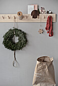 Brown paper bag and coat rack with Christmas decorations