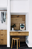 Small built-in desk in an alcove next to the wardrobe