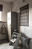 Vintage metal locker and step ladder in corner of room