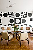 Living room in 60s style with black and white wall decoration