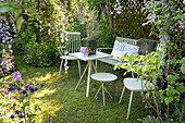 Various seating furniture and a small table in the garden
