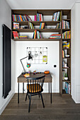 Small writing corner with bookshelves
