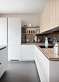 L-shaped fitted kitchen with wooden elements