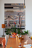 View over dining table to tapestry and dreamcatchers