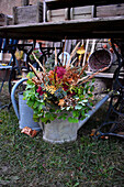 Zinc watering can with bouquet of autumn flowers
