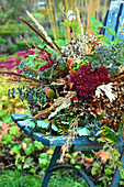 Autumnal bouquet on garden chair