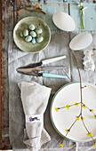 Easter still life with quail eggs and spring decorations