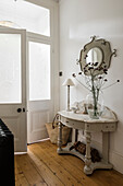 White console table with mirror in the entrance area