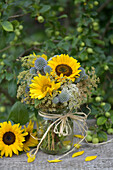 Late summer bouquet with sunflowers and globe thistles