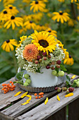 Colourful late summer bouquet with sunflowers, blackberries, hydrangeas, dahlias, Queen Anne's lace and crabapples