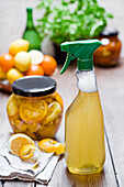Homemade cleansing agent, vinegar, peels of citrus fruits, ginger and water
