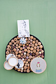 Upcycling, old corks, , pinboard with portrais and photos on canvas in embroidery frame