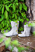 Concrete boots on steps as garden decorations