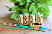 DIY plant labels made of corks and wooden skewers